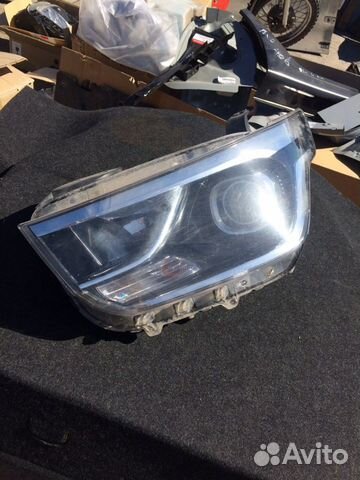 Фара левая grand Starex H1 TQ