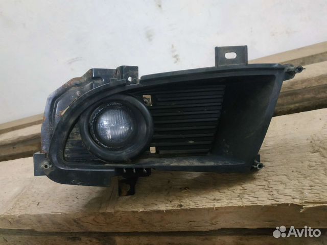 Фонарь противотуманный левый Митсубиси Лансер