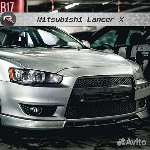 Центральная вставка между клыков Митцубиси Лансер